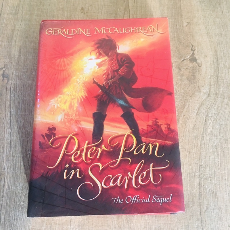 Peter Pan in Scarlet, Geraldine Mc.Caughrean หนังสือ วรรณกรรมเยาวชน ปกแข็ง ภาษาอังกฤษ (มือสอง) ขนาด Pocket Book  สภาพ ดี