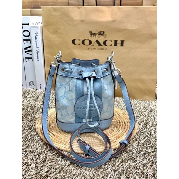 COACH MINI DEMPSEY BUCKET BAG IN SIGNATURE JACQUARD WITH STRIPE AND COACH PATCH