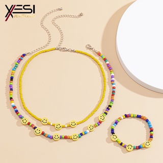 🌞【✅XESI】🌞 2 ชิ้นสร้อยคอและสร้อยข้อมือสร้อยคอลูกปัดข้าวที่มีสีสันเรียบง่ายผู้หญิงสร้อยข้อมือยิ้มสีเหลืองหรูหรา