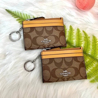 พวงกุญแจ ใส่บัตร ใส่เหรียญ MINI SKINNY ID CASE IN SIGNATURE CANVAS  (COACH 88208) ลายซีสีน้ำตาล สีเหลืองทอง