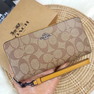 COACH LONG ZIP AROUND WALLET IN SIGNATURE CANVASS