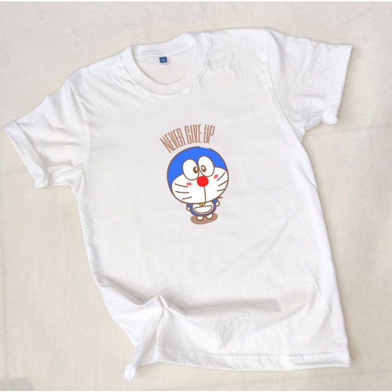 KATUN BLACKTEE เสื้อยืด Doraemon Never Give Up ทําจากผ้าฝ้ายนุ่มพิเศษระดับพรีเมียม