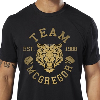 REEBOK เสื้อยืดแขนสั้น ลาย Conor McGregor golden tiger MMA สําหรับเล่นกีฬามวย