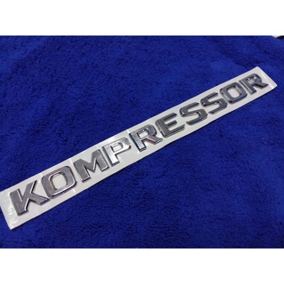 โลโก้คำว่า KOMPRESSOR สีชุปโครเมี่ยม ( SIZE 2×24cm) ราคาต่อ 1ชิ้น