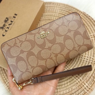 COACH LONG ZIP AROUND WALLET IN SIGNATURE CANVASS