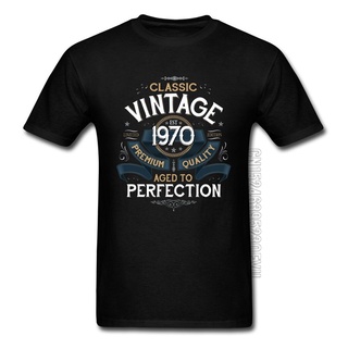 เสื้อยืดสีขาวเสื้อยืดลําลอง ผ้าฝ้าย 100% แขนสั้น พิมพ์ลาย Aged To Perfection 1970 สไตล์วินเทจ คลาสสิก โอเวอร์ไซซ์S-4XL