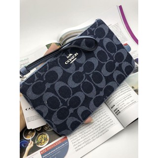 Coach LARGE WRISTLET IN SIGNATURE DENIM