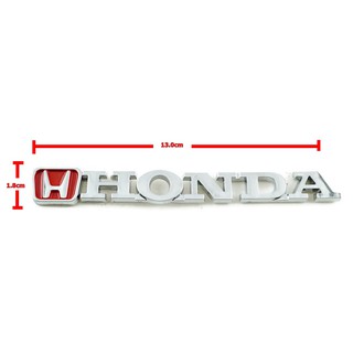 ป้ายโลโก้ HONDA มีตัวHอยู่ด้านหน้าคำว่าฮอนด้า พลาสติกสีโครเมี่ยม/แดง ขนาด 13.0X1.8 cm ติดตั้งด้วยเทปกาวสองหน้าด้านหลัง