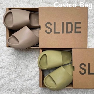 【บางกอกสปอต】YEZZY SLIDES รองเท้าแตะมะพร้าวชายสวมคู่ฤดูร้อนslideรองเท้าแตะฤดูร้อนกลางแจ้งหนาหญิง รองเท้าแตะชายน้ำ