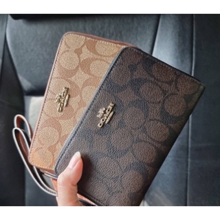 กระเป๋าสตางค์ COACH F57468 PHONE WALLET IN SIGNATURE COATED CANVAS