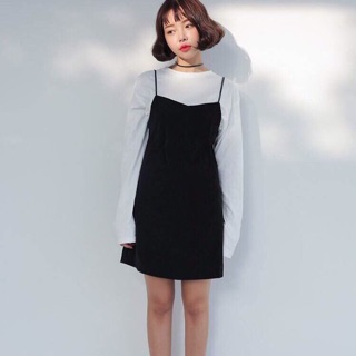 White long-sleeve and black mini dress