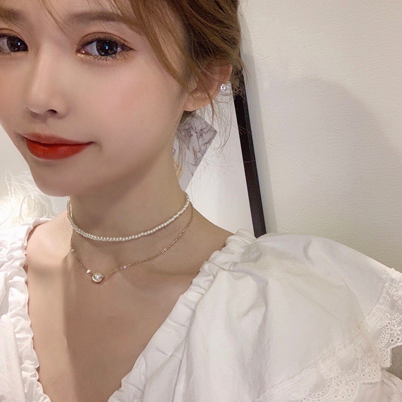ทงแดมุนสไตล์ใหม่ของเกาหลีใต้ที่สง่างามและมีอารมณ์สร้อยคอมุกนางฟ้าสองชั้นโซ่ไหปลาร้าสร้อยคอโช้คเกอร์