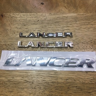 โลโก้ LANCER ติด MITSUBISHI