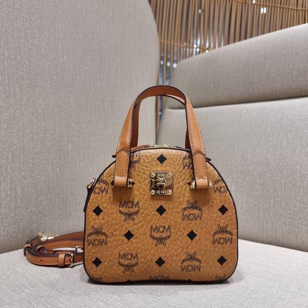 กระเป๋า MCM MINI ESSENTIAL HALF MOON DISCO TOTE IN VISETOS