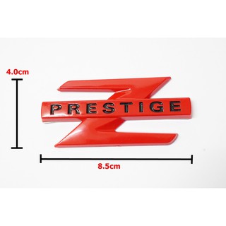 ป้ายโลโก้ท้าย ISUZU ZPRESTIGE พลาสติกสีแดง ขนาด 4.0x8.5cm ติดตั้งด้วยเทปกาวสองหน้าด้านหลัง