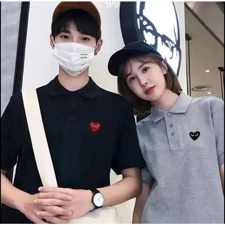 เสื้อโปโลลําลอง ปักลายโลโก้หัวใจ สีดํา สไตล์นักธุรกิจ แฟชั่นสําหรับผู้ชาย และผู้หญิง