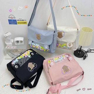 🍬กระเป๋าสะพาย Bear Paw cross bag🍭 ใบนี้แถมฟรีลูกปอมๆหลากสีให้ทุกใบ เนื้อผ้ากันน้ำ น่ารักสดใสสุดๆ