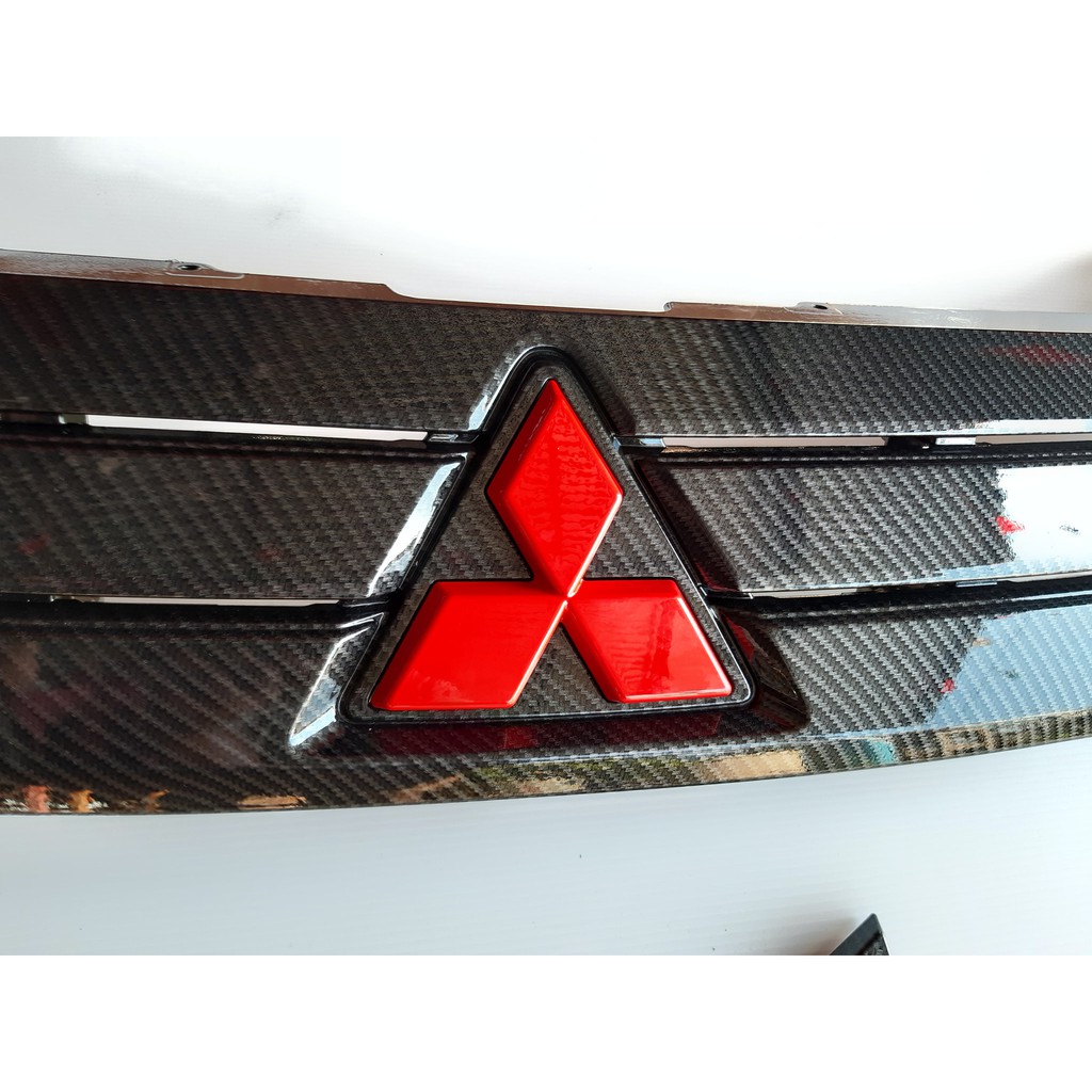 มิตซูบิชิ เอ็กแพนเดอร์ กระจัง Mitsubishi Xpander 2017-2019 เคลือบเคฟล่าหน้าดำ โลโก้สีแดง พ่นเคลือบ 2k  ทนทุกสภาวะอากาศ