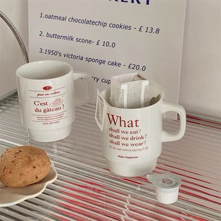 แก้วกาแฟเซรามิค อักษรสีแดง What shall we eat? &amp; C’eat du gateau!