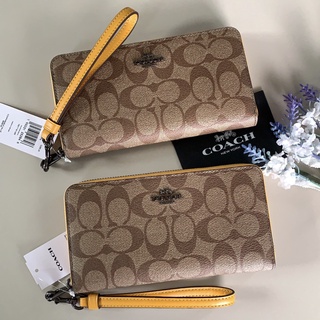 พร้อมส่งแท้💯กปต.ใบยาว ซิปรอบรุ่นใหม่ล่าสุด มีสายคล้องแขน coach C4452 LONG ZIP AROUND WALLET IN SIGNATURE CANVAS