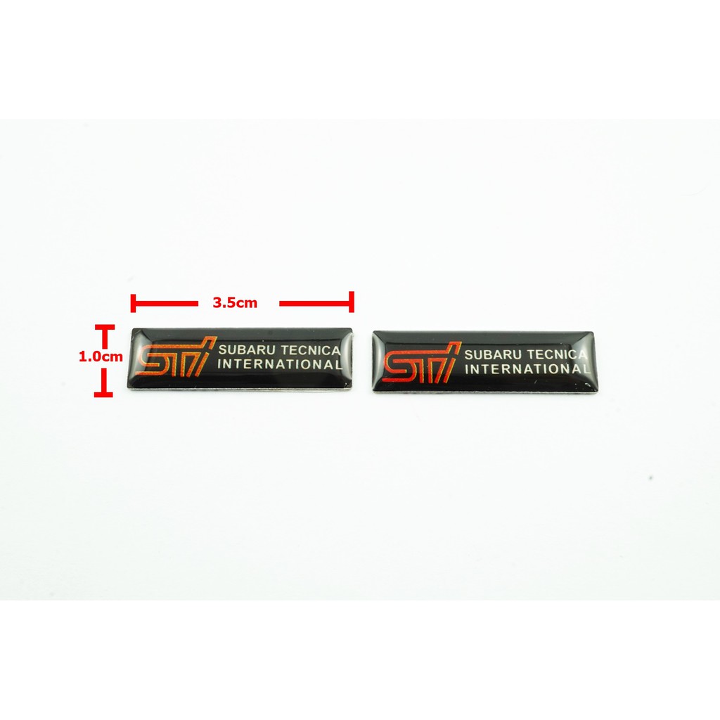 2ชิ้นป้ายโลโก้เลซิ่น STI SUBARU TECNICA INTERNATIONAL พื้นดำขนาดเล็ก 3.5x1.0cm ติดตั้งด้วยเทปกาวสองหน้าด้านหลัง