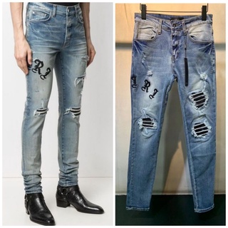 AMIRI new ripped knife cut and leather slim jeans