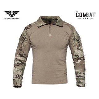 เสื้อคอมแบทเชิ้ต ( Combat shirt ) เนื้อผ้ามีส่วนผสมของ Spendex ยืดได้ มีแผ่น Velcro ตีนตุ๊กแก ทั้งสองข้างแขน สีแคมพราง