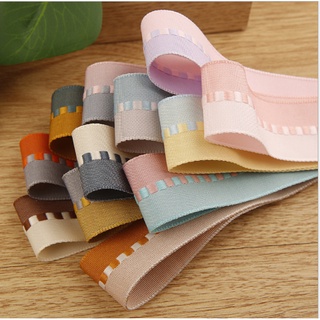 พร้อมส่ง ริบบิ้นผ้า 2 สี ตรงกลาง สลับลาย ขนาด 38 มม.