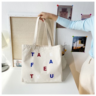 J155 กระเป๋าผ้าแคนวาส T A E F E A T V U ขยายก้น ใส่ของได้เยอะ ลายตัวอักษรคิ้ว ๆ