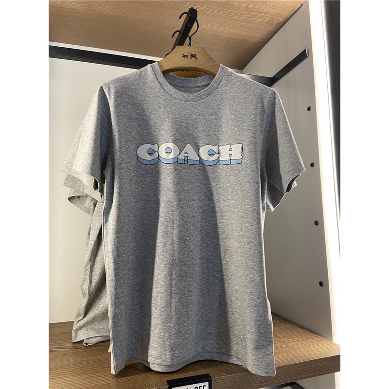 Coach เสื้อยืดแขนสั้น ผ้าฝ้าย พิมพ์ลายโลโก้ สีพื้น สไตล์คลาสสิก สําหรับผู้ชาย