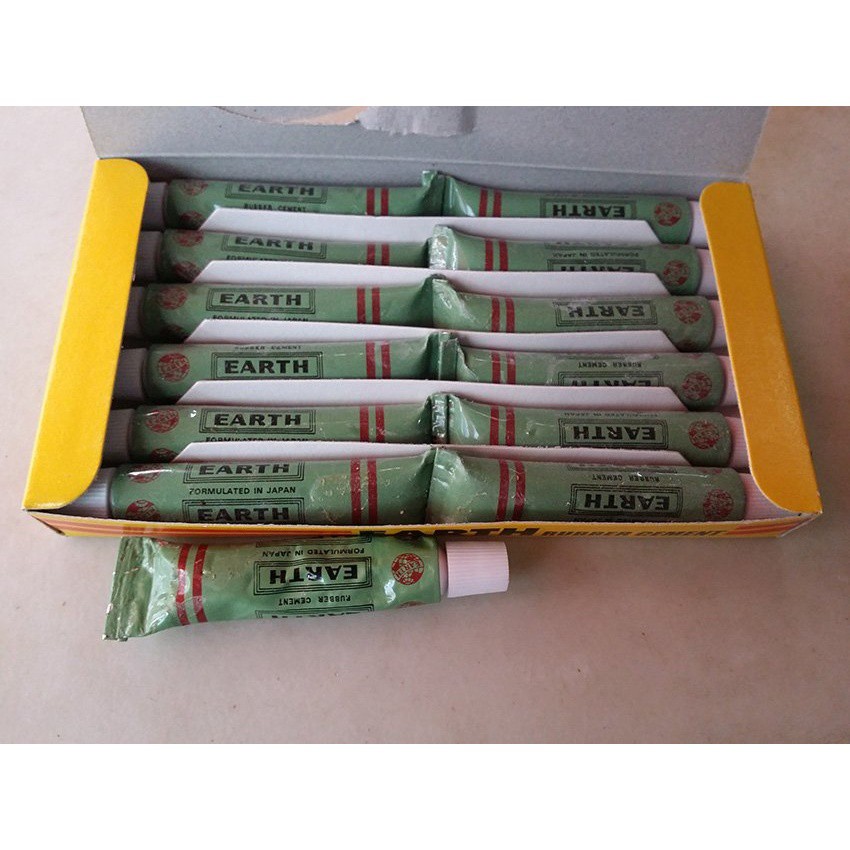 VAUKO : EARTH TIRE RUBBER CEMENT GLUE กาวปะยางรถจักรยาน มอเตอร์ไซด์ รถยนต์ 1 กล่อง (12 หลอด)