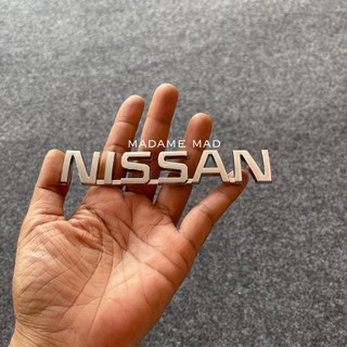 โลโก้ NISSAN ขนาด 12.2x2.2cm (สีเงิน)