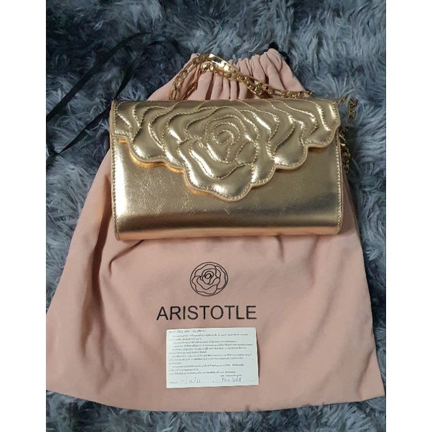 กระเป๋าสะพายกระเป๋าสะพาย ARISTOTLE สี Pink Glod💯% มือสอง ถอดสายถือเป็นคลัชได ขอดูรูปเพิ่มเติมได้
