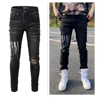 AMIRI diamond-studded ripped slim jean