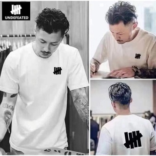 เสื้อยืดพิมพ์ลายแฟชั่นพร้อมส่ง UNDEFEATED เสื้อยืดแขนสั้น ผ้าฝ้าย โอเวอร์ไซซ์ ใส่สบาย สําหรับผู้ชาย และผู้หญิง