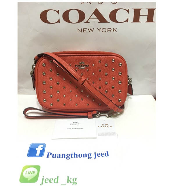 Used like new COACH F56533 CROSSBODY CLUTCH IN POLISHED PEBBLE LEATHER WITH OMBRE RIVETS