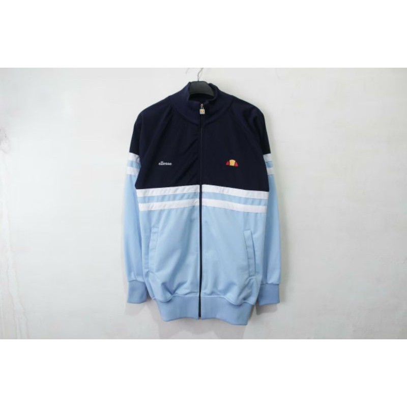 ต้นฉบับ ELLESSE REMINI NAVY SKY BLUE PREMIUM เสื้อแจ็คเก็ตติดตามผู้ชาย