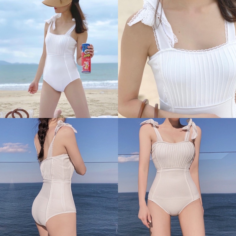 พร้อมส่งจากไทย saleบิกินี่ผู้หญิง ชุดว่ายน้ำผู้หญิง วันพีชผูกไหล่สีขาวแต่งลูกไม้