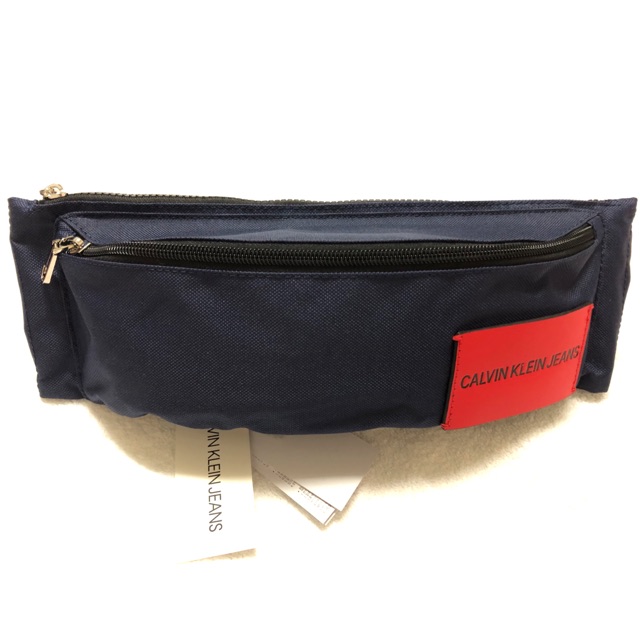 CALVIN KLEIN JEANS SLING BAG (Navy-Red) กระเป๋าคาดเอว-คาดอก สีน้ำเงินป้ายแดง รุ่น HH1504K4300
