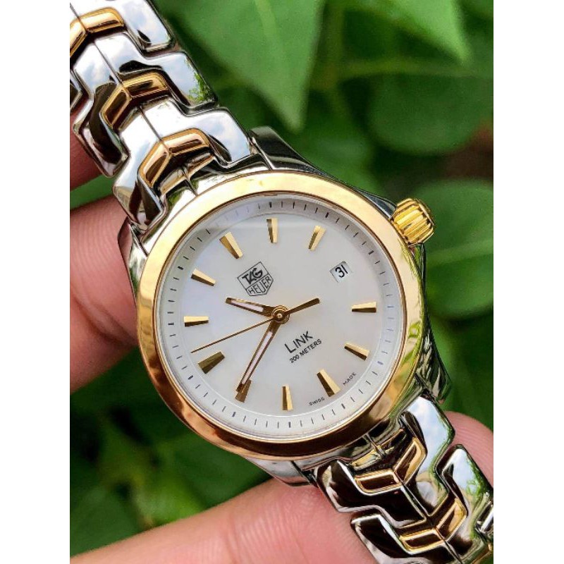 Tag Heuer 18K lady size 3⅙ mm.