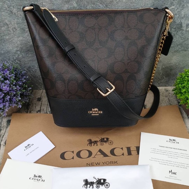 COACH SMALL PAXTON DUFFLE IN SIGNATURE CANVAS (COACH F76669)