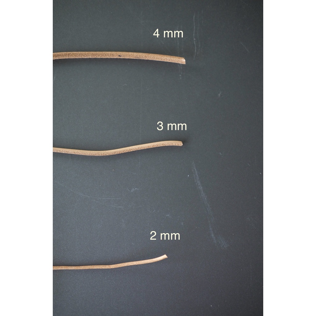 เชือกหนังกลมแท้  ขนาด 2 มิล สีธรรมชาติ ใช้สำหรับทำเป็นที่ห้อยกุญแจ ถัก หรือสายกระเป๋า แบ่งขาย ( เป็น
