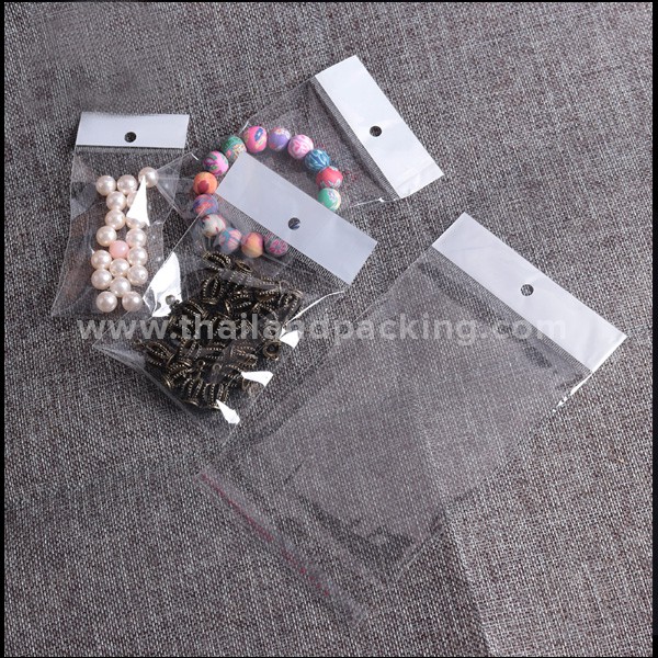 ถุงใส่เสื้อผ้า ถุงฝากาว OPP แถบขาวมีรูแขวน สีใส ตั้งไม่ได้ [100 ใบ] - Thailandpacking