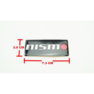 ป้ายโลโก้อลูมินั่ม NISMO สีดำขนาด 7.3x3.0cm ติดตั้งด้วยเทปกาวสงหน้าด้านหลัง