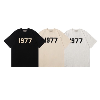 เสื้อยืดแขนสั้นลําลอง ผ้าฝ้าย พิมพ์ลายตัวอักษร ESSENTIALS 1977 แฟชั่นสําหรับผู้ชาย และผู้หญิง