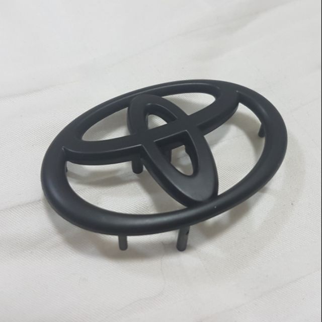 TOYOTA  LOGO FOR STEERING WHEEL โลโก้ติดพวงมาลัย เดิม สีดำ 6.5 CM