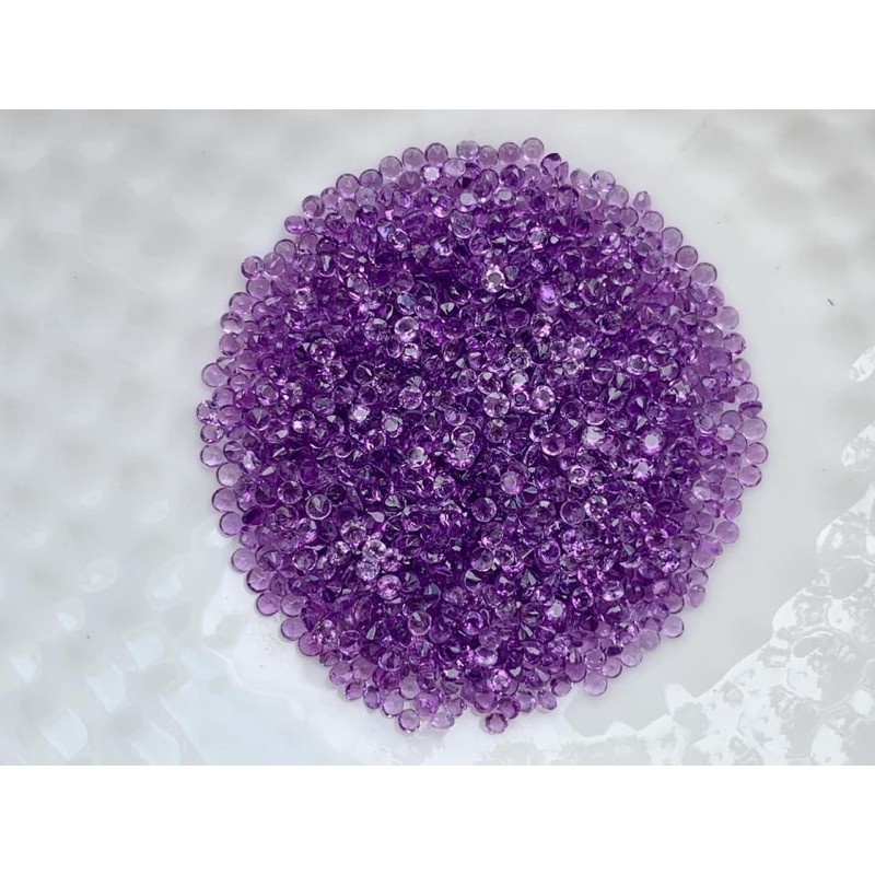 1.5mm. พลอยอเมทิสกลมเจียรเกลี่ยม ราคากะรัตละ 100 บาท