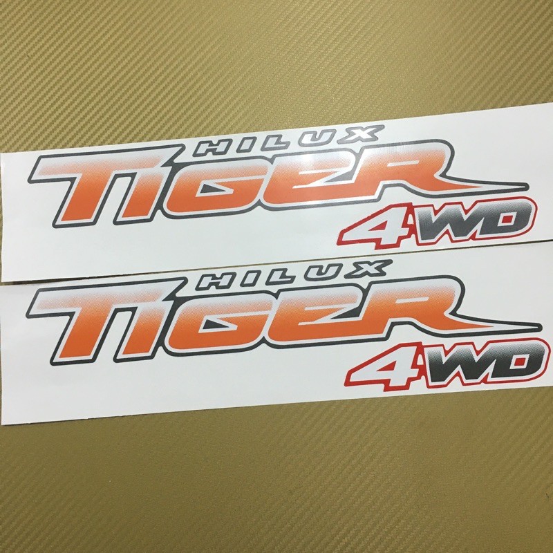 สติกเกอร์ TIGER D4D 4WD สีส้ม ติดข้างท้ายกระบะ  Toyota HILUX ปี 2003 ราคาต่อคู่ มี 2 ชิ้น