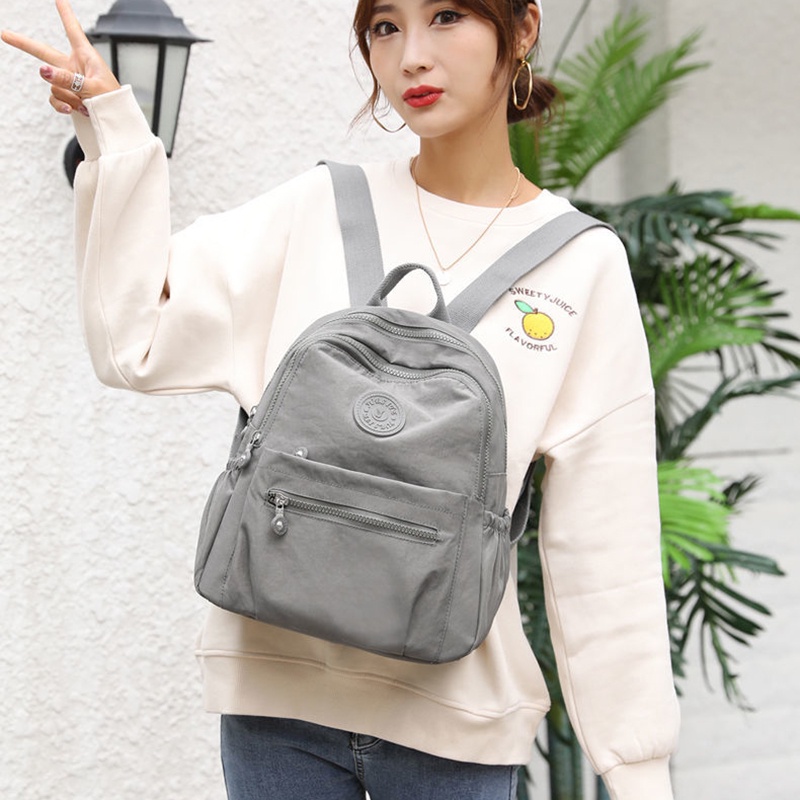 IELGY กระเป๋าเป้สะพายหลังผ้าไนลอนน้ําหนักเบาสําหรับเดินทางพร้อมฟังก์ชั่นความจุขนาดใหญ่และกันน้ํา - รูปที่ 7