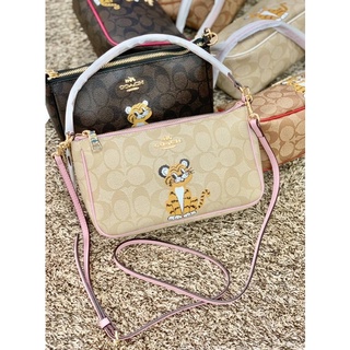 COACH TOP HANDLE POUCH SIGNATURE WITH BABY TIGER PRINT